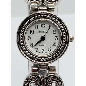 Sunrise women's dress watch. Decorative bevel. Heart brackets connect to band